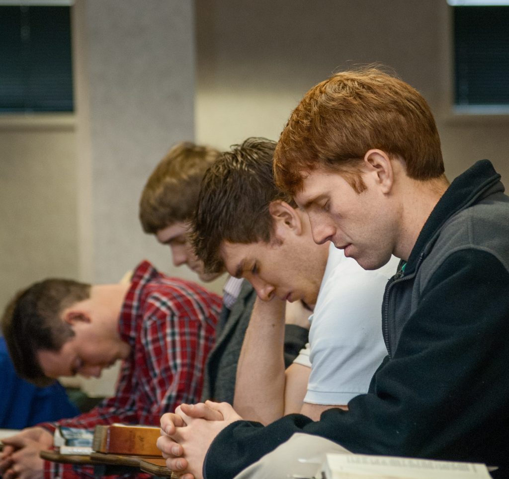 Student praying during the Society session of the Spring Day of Prayer, BJU, Greenville, SC, February 24, 2011