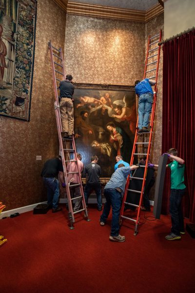 Removing a painting from the wall of the Museum and Gallery