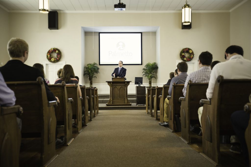 A pastor preaching to a congregation