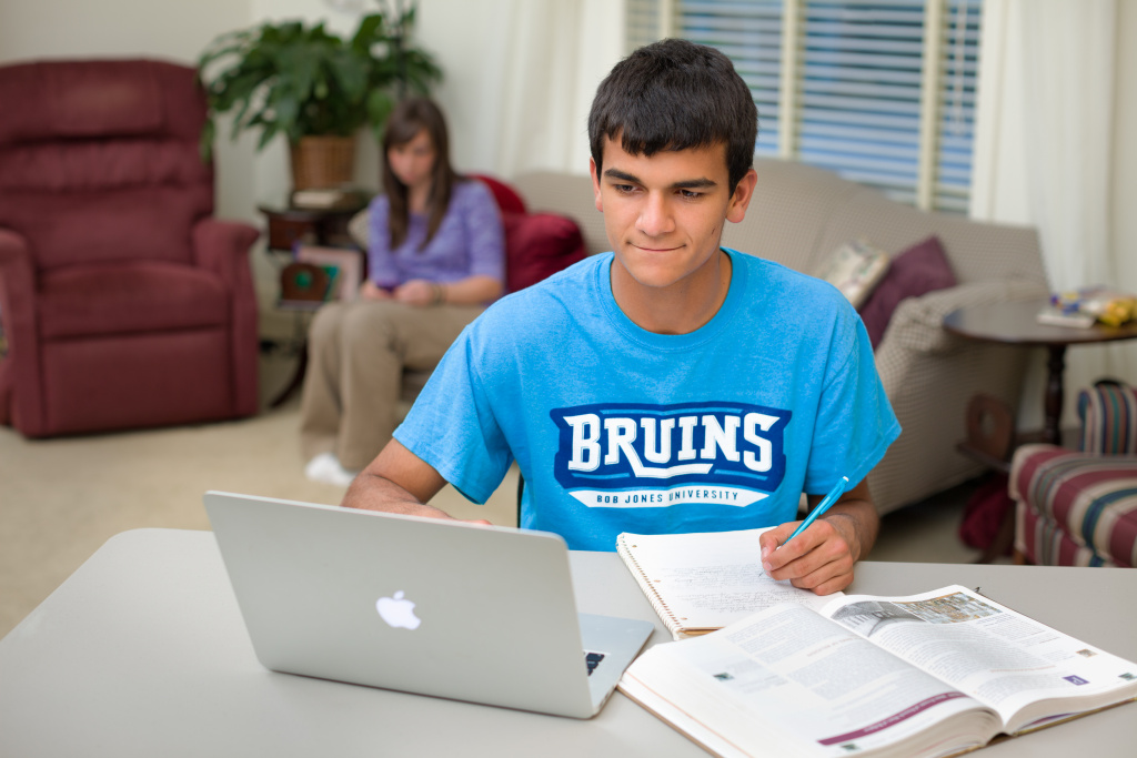 Photo of a high school studying for online distance learning course