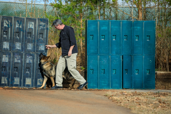 Gardner and Diesel at practice lockers at the Greenville County Sheriff Office Center for Advanced Training