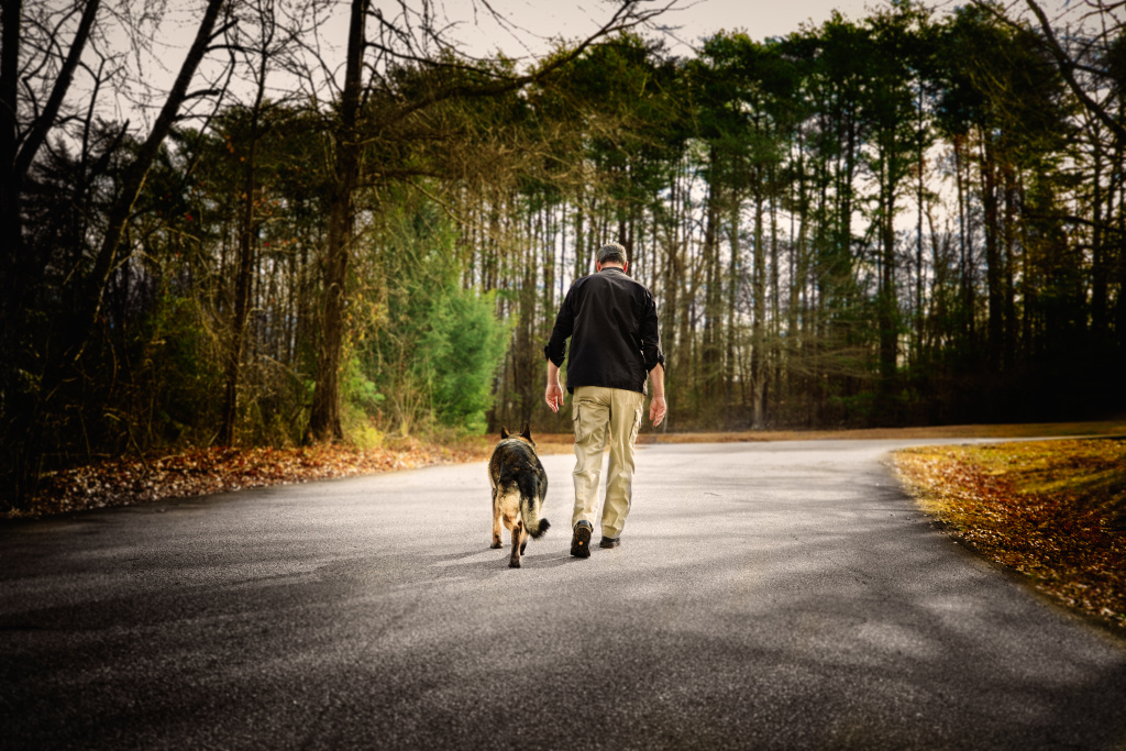 John Gardner walking with his dog Diesel