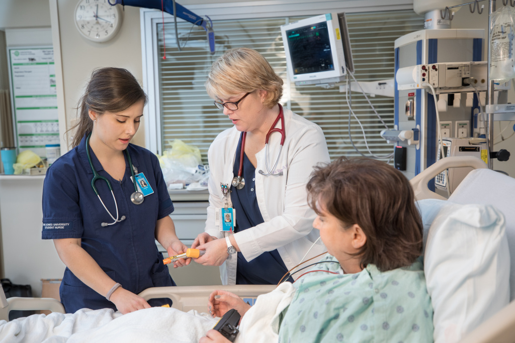 Dr. Kat Wampole instructs student in nursing