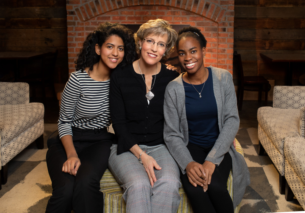 Campus parent program member Sherry Miller, with her two international students, Miranda Trabal and Ade Awo-Osagie