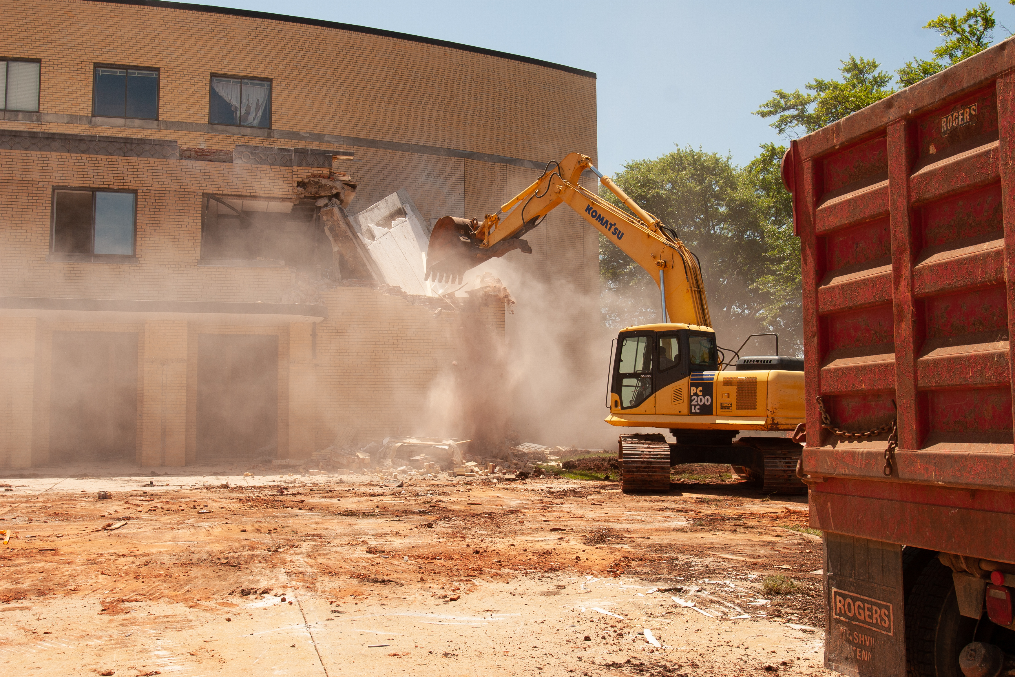 A backhoe demolishes what students affectionately termed "the shoebox" (Photo by Hal Cook)
