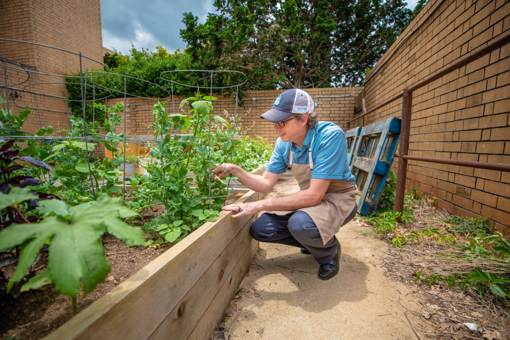 Brent Wustman tends the dining services garden at BJU
