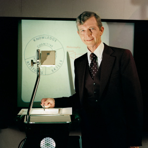 Photo of Dr Walter Fremont in classroom with projector taken in 1979