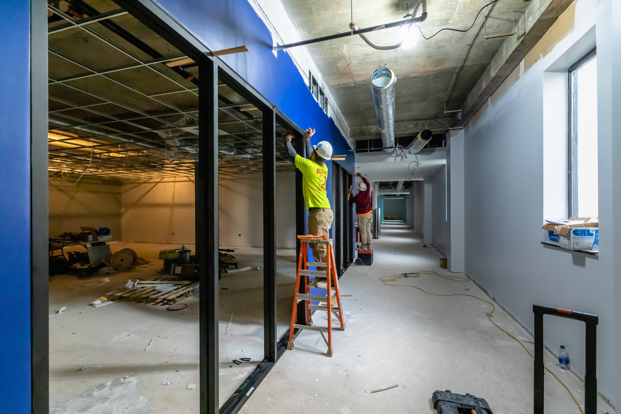 The main first floor reading room is now a blue hallway (Photo by Derek Eckenroth)