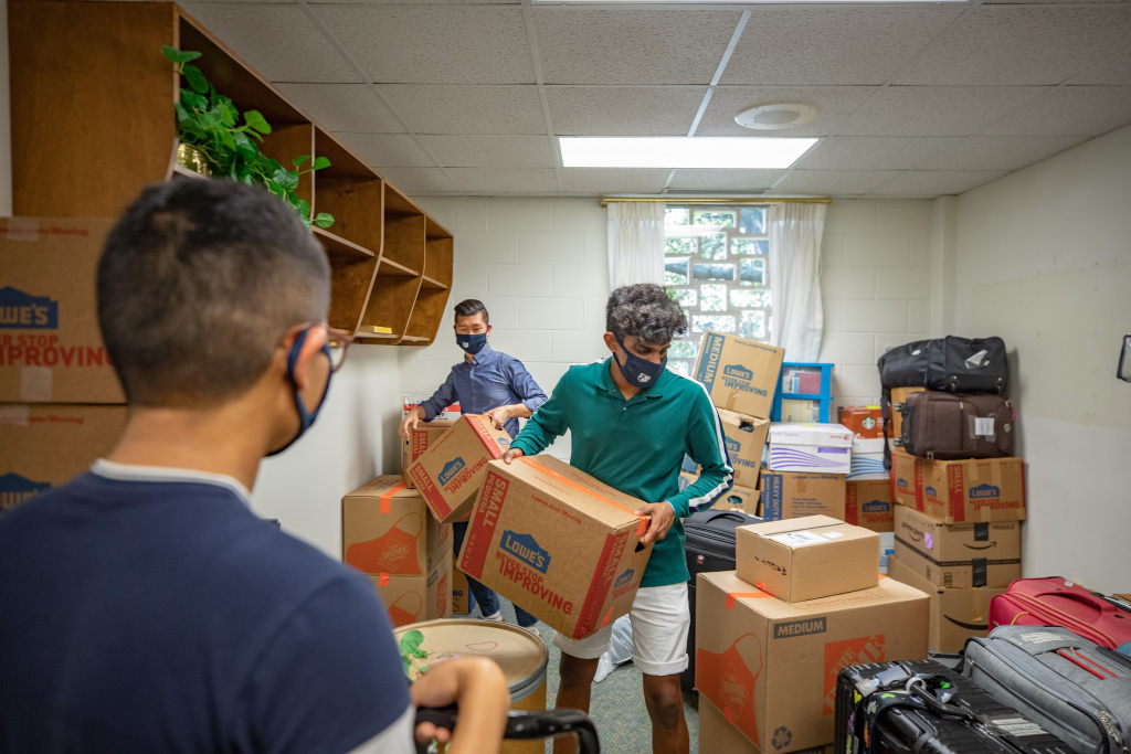 Students help move boxes