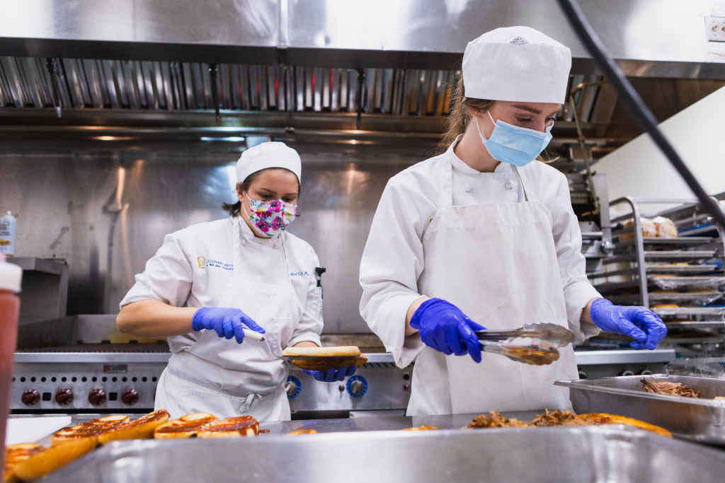 Culinary arts students prepare food for the 2020 bistro