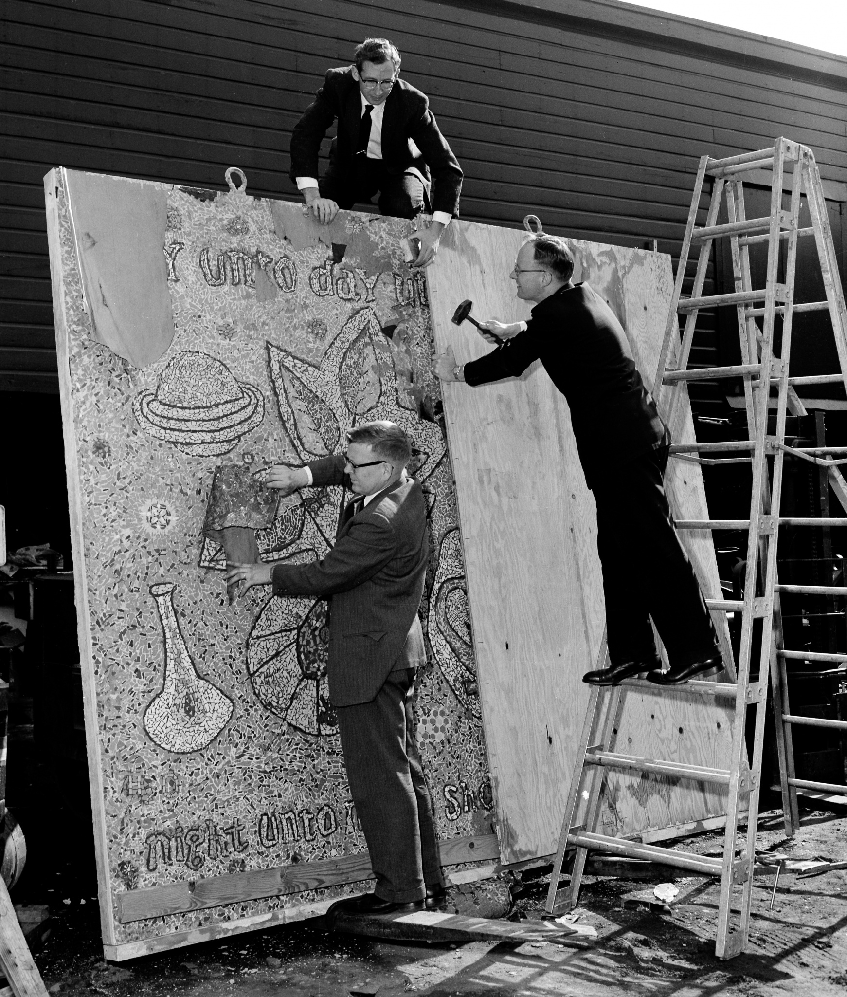 Photo of art faculty Emery Bopp, Carl Blair and Darrell Koons working on the mosaic, 1959