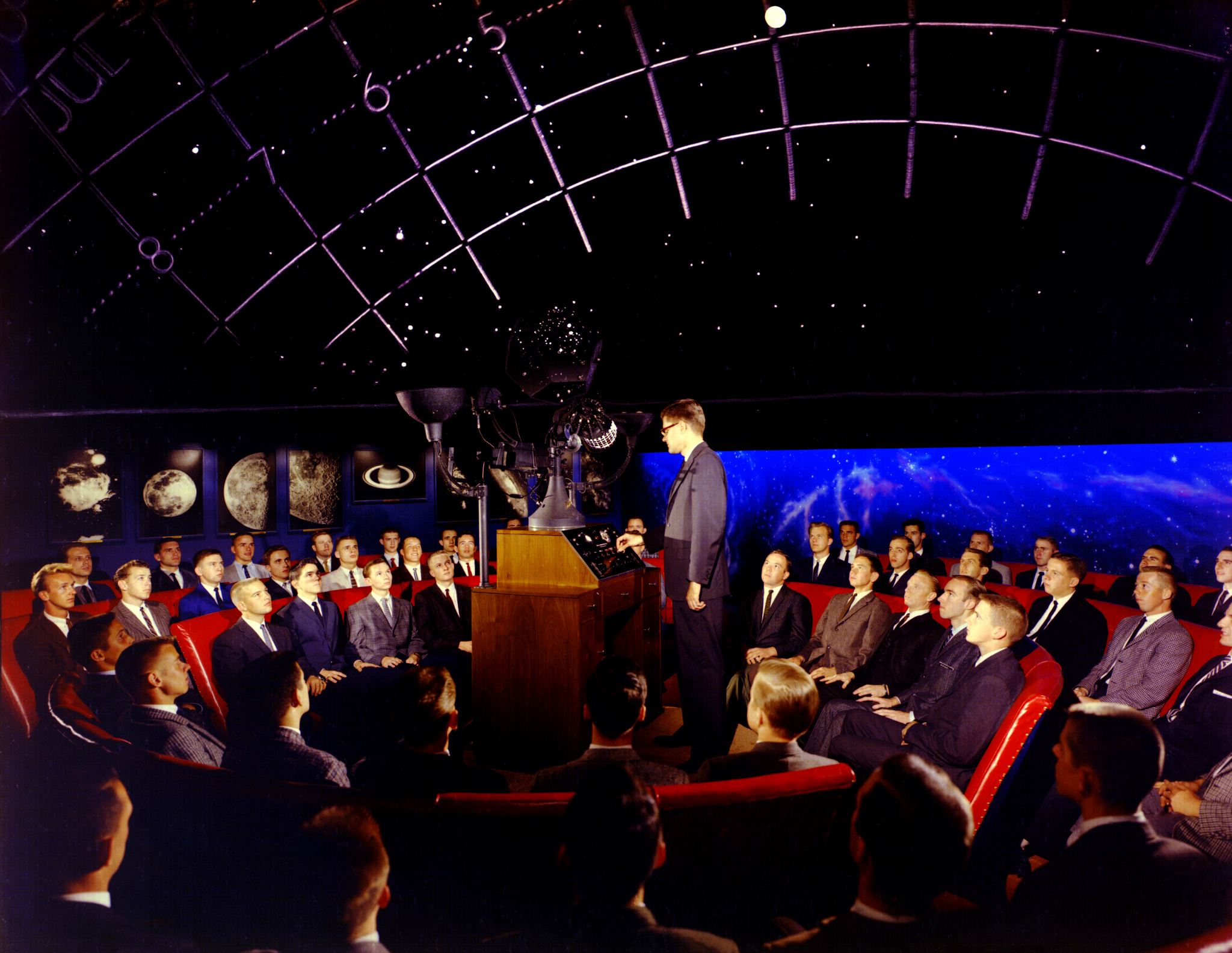 Photo of an audience watching a planetarium showing