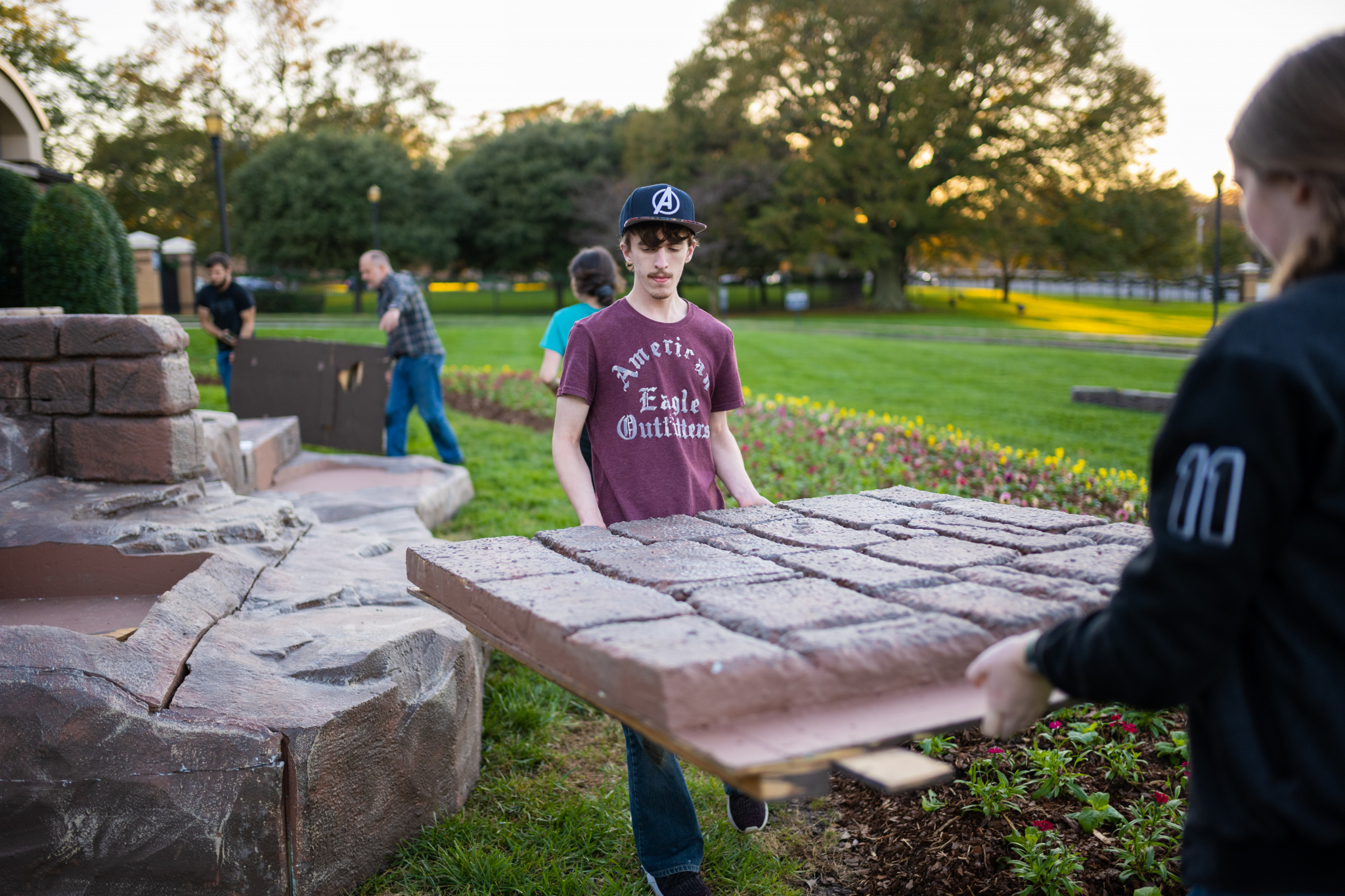 Student workers from Rodeheaver stage crew install the creche at the front gate (Photo by Derek Eckenroth)