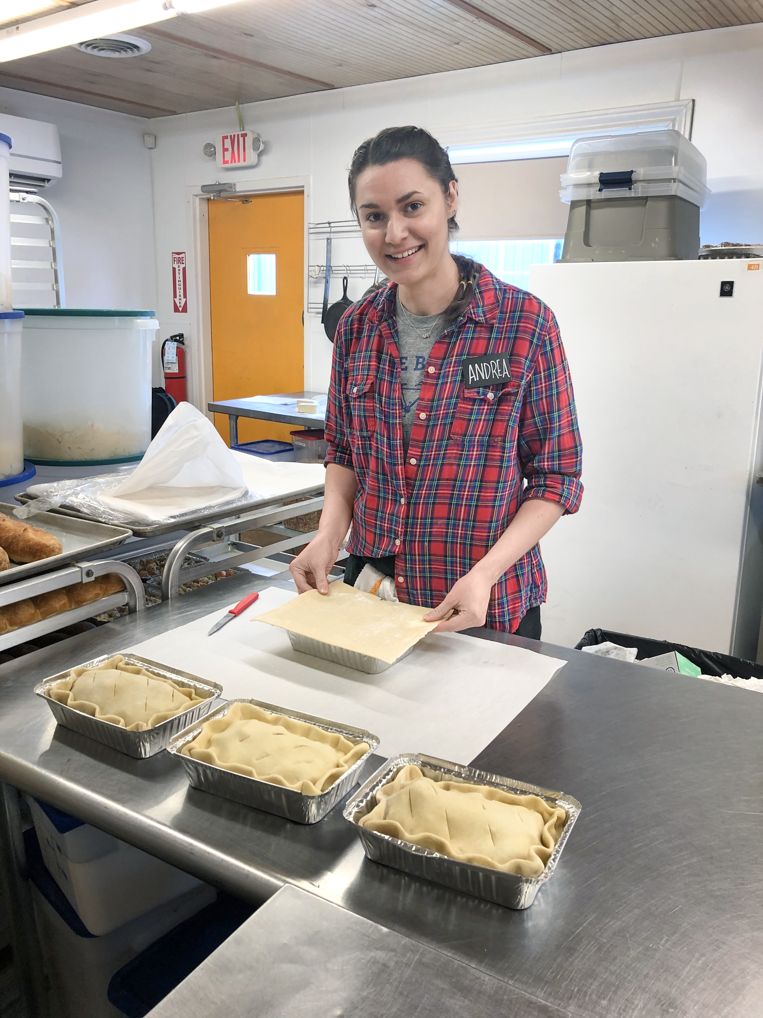 BJU culinary arts alumni Andrea Jacquette in the kitchen of the Swamp Rabbit Cafe preparing chicken pot pies