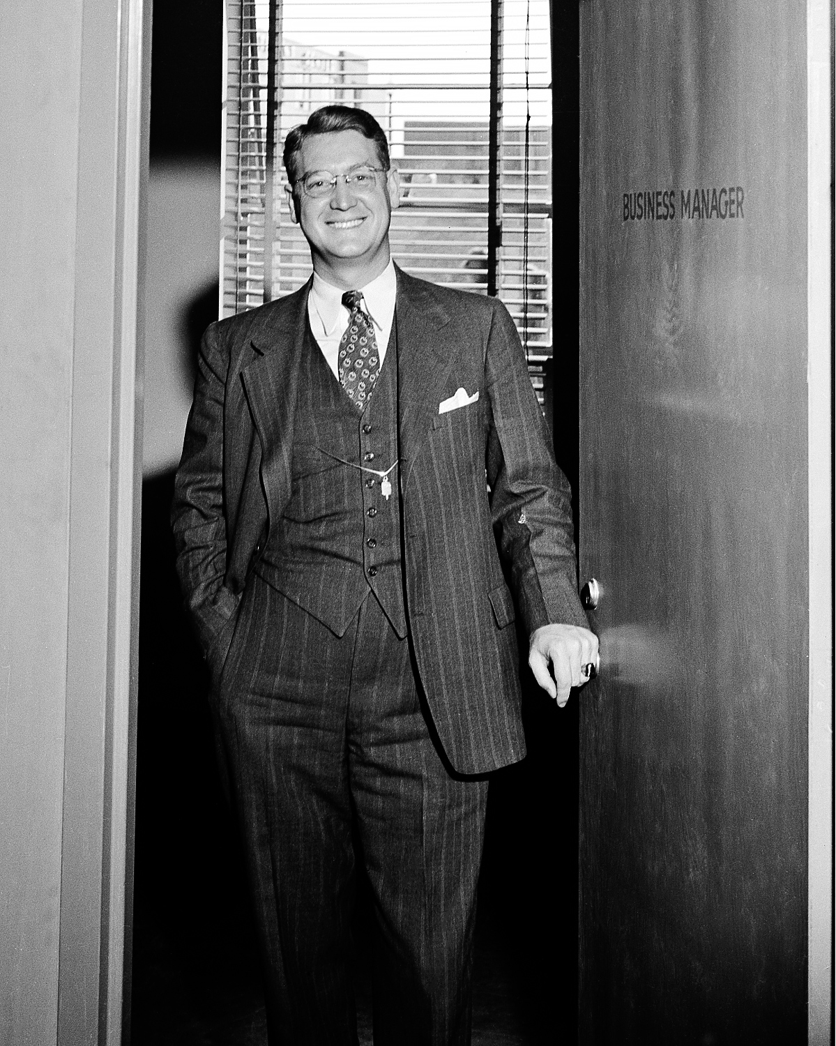 R.K.Johnson in the doorway to the Business Office, c. 1950