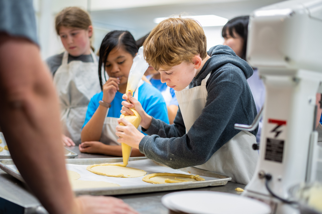 Campers participate in Pastry Perfection, an EDUcamp Jr.