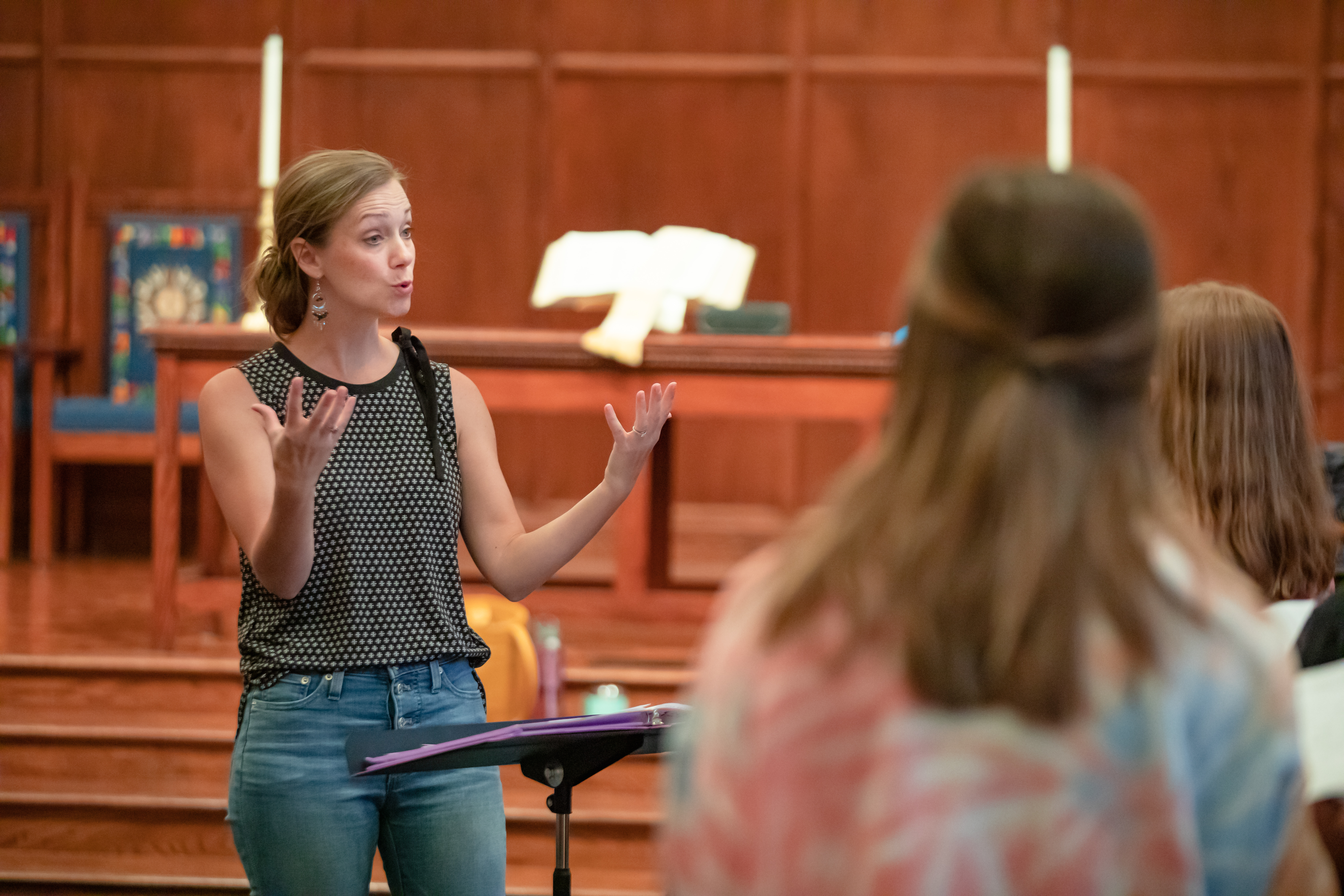 Laura Brundage conducts the older choirs of the Greenville Youth Chorale